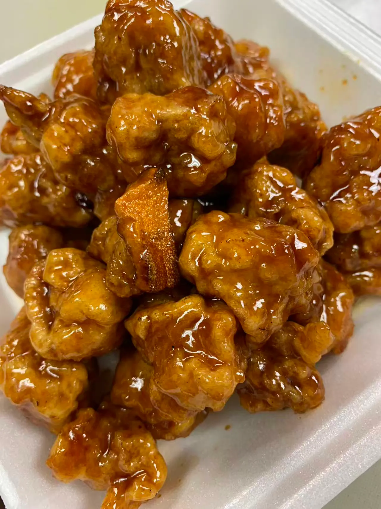 Glazed honey chicken bites in takeout container at Asian N Cajun 2, a Asian Fusion Cajun Seafood Restaurant in Fair Oaks